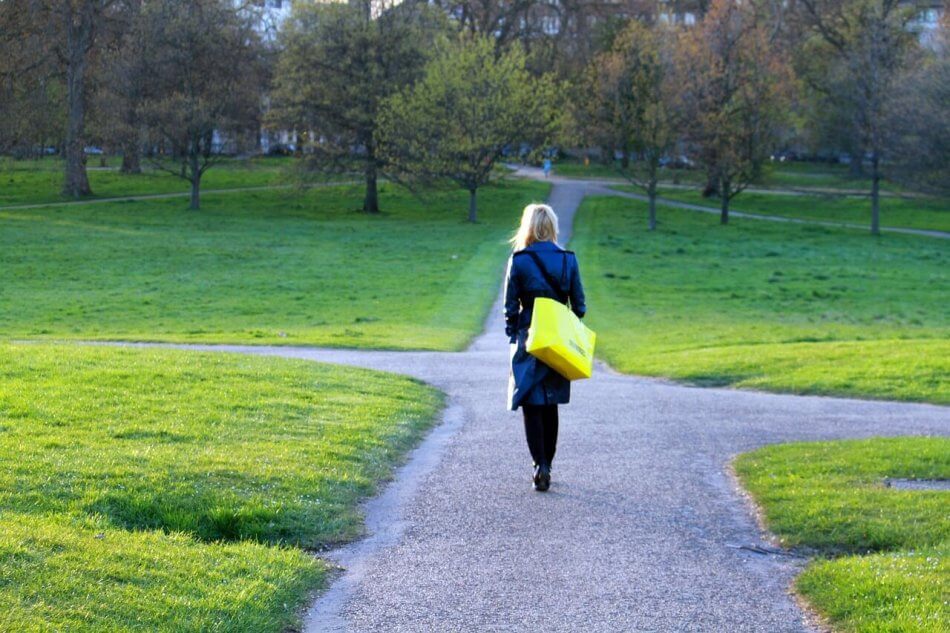 woman at crossroad debating life shift